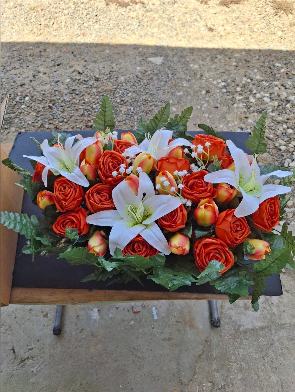 Artificial Orange Rose and White Lily Floral Arrangement Memorial Saddle.